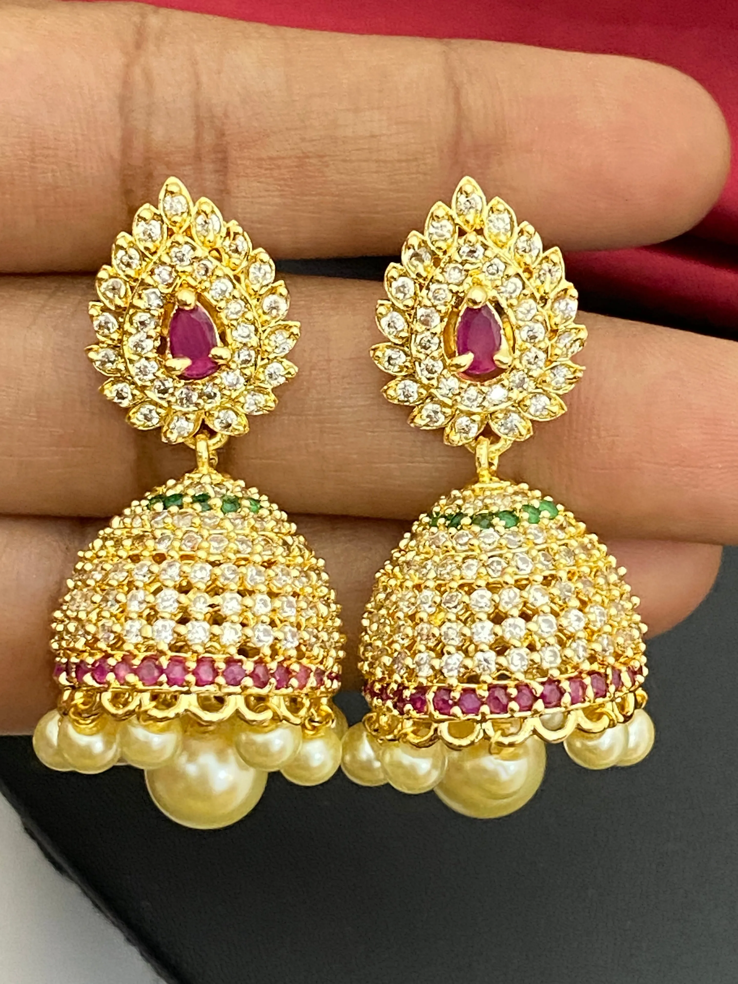 Splendid Traditional Wear Gold plated Jhumka Earrings With Pearl Drops